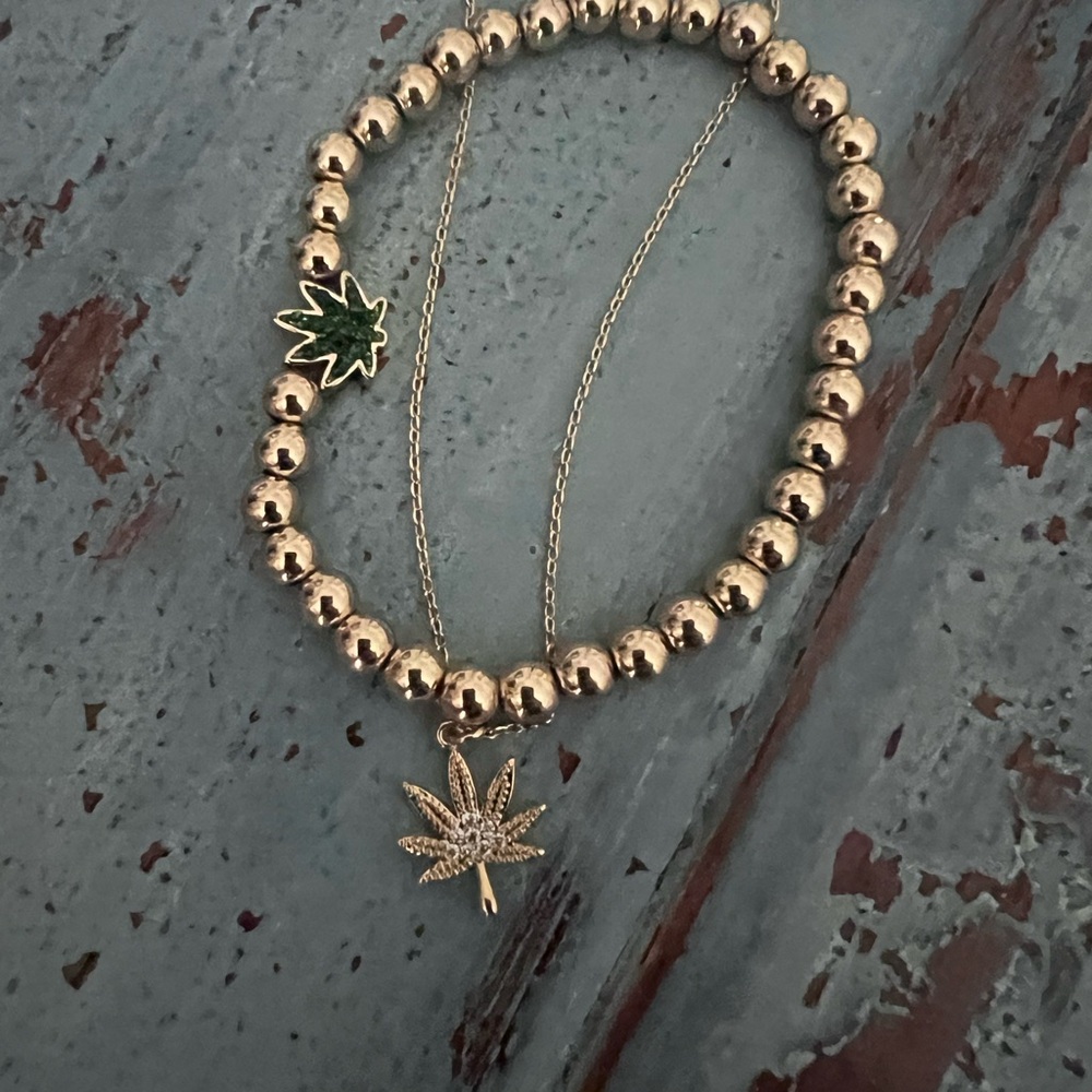 Gold Beaded Bracelet with leaf charm and gold leaf necklace.